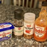 Buffalo sauce ingredients: butter, black peppercorns, crushed red pepper and Frank's RedHot