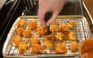 Cauliflower Buffalo Wings saucing
